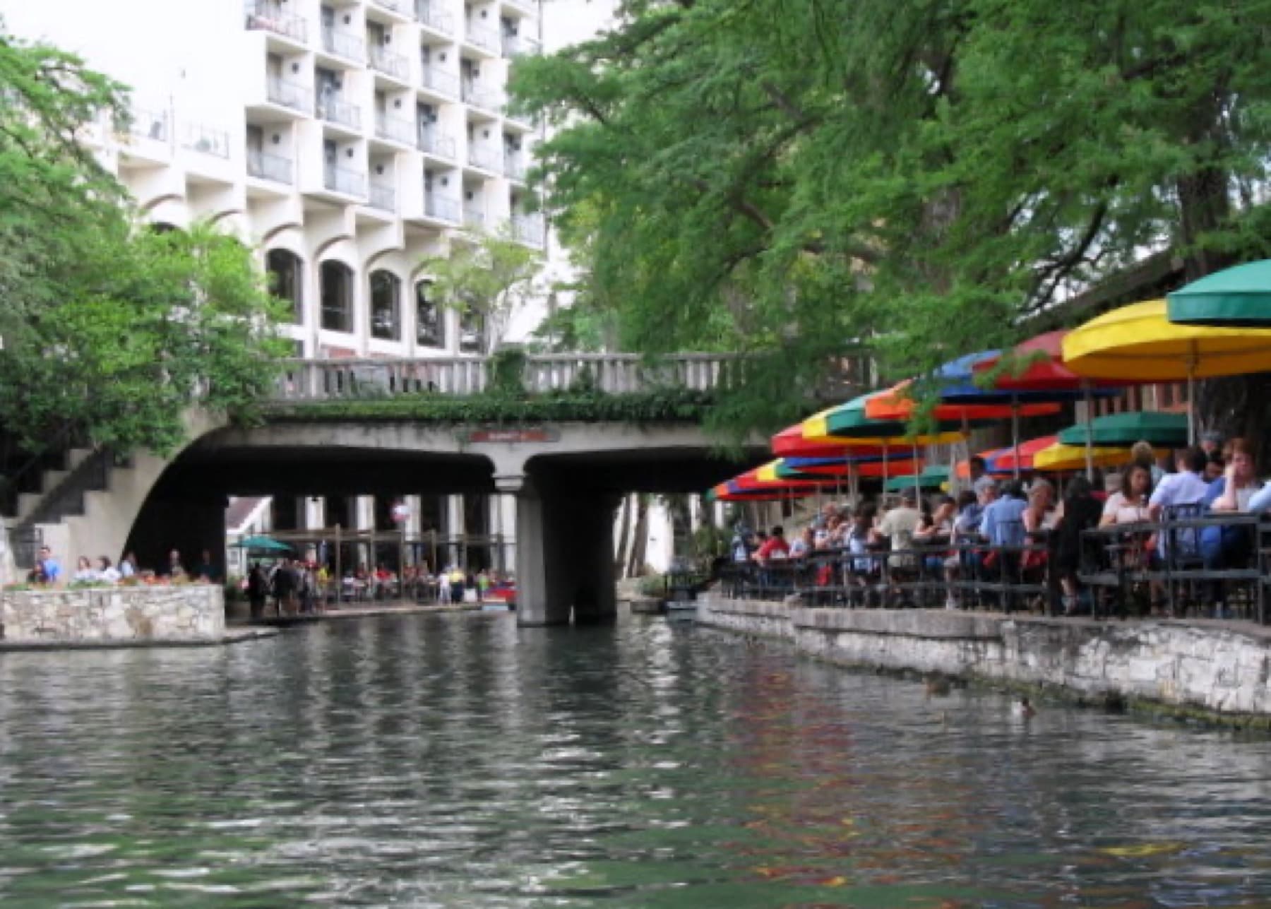 Downtown San Antonio River Walk with bridges, cafes, and skyline details