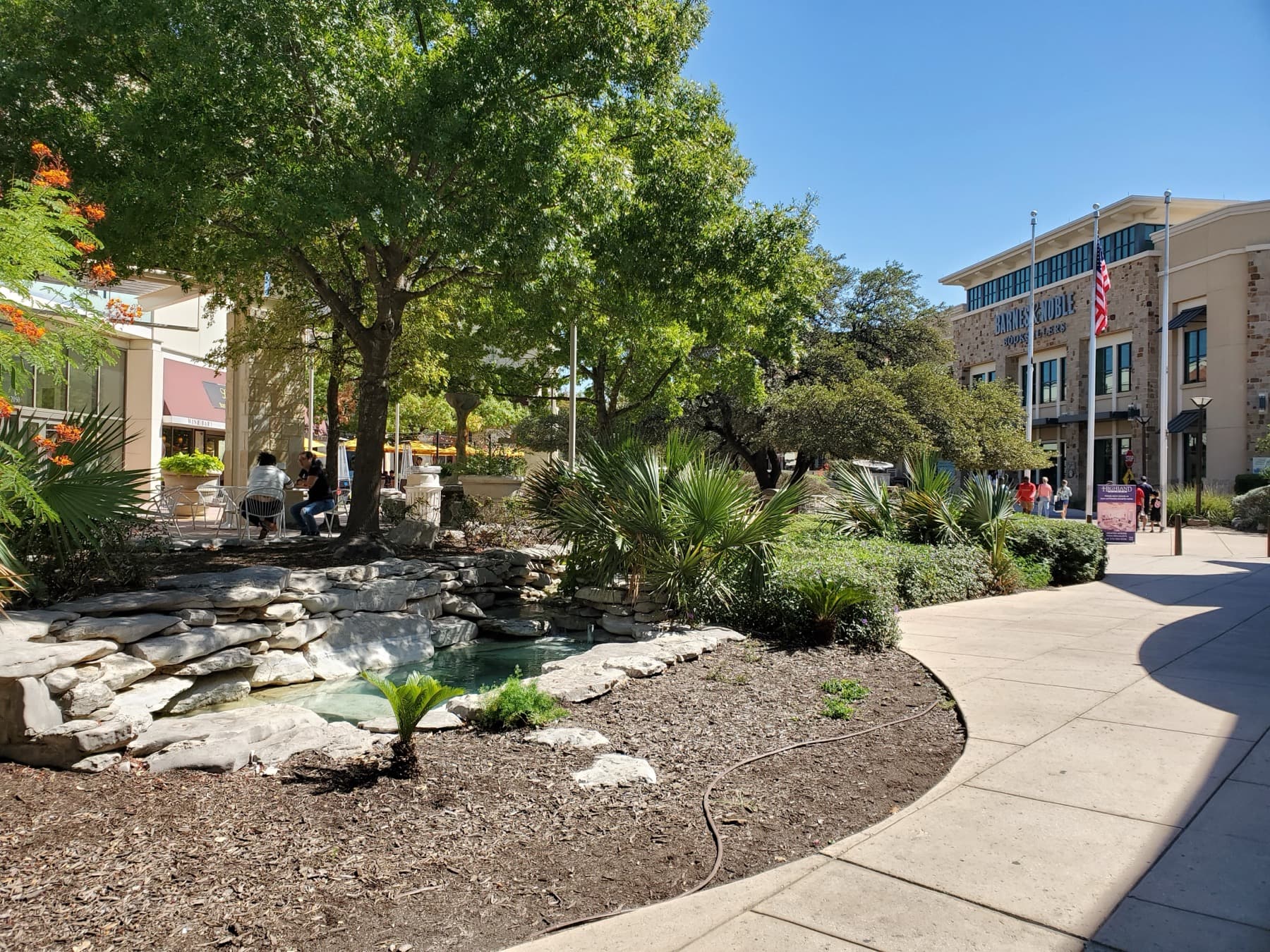 Open-air shopping and palm-lined walkways at The Shops at La Cantera